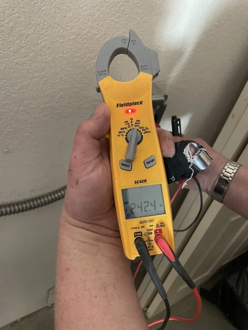 Voltage testing with clamp meter during Generator Installation in Heber
